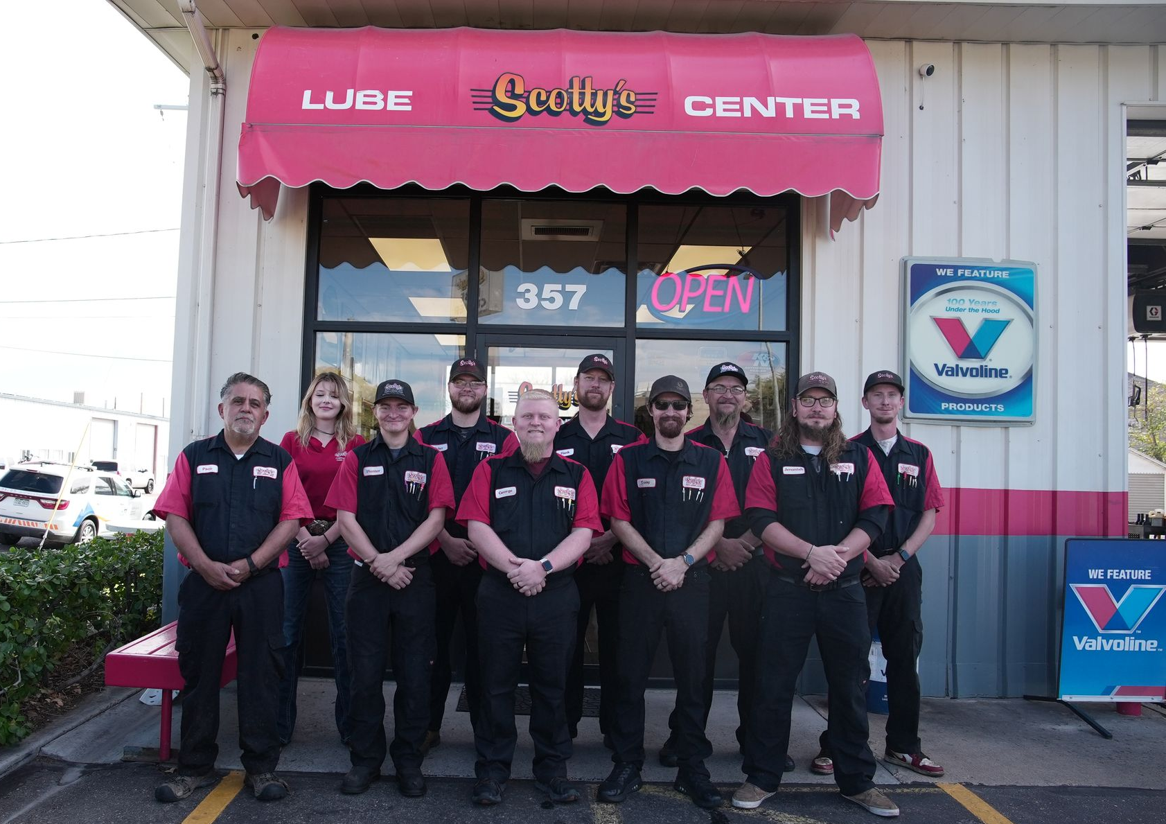 Group of auto shop employees in front of