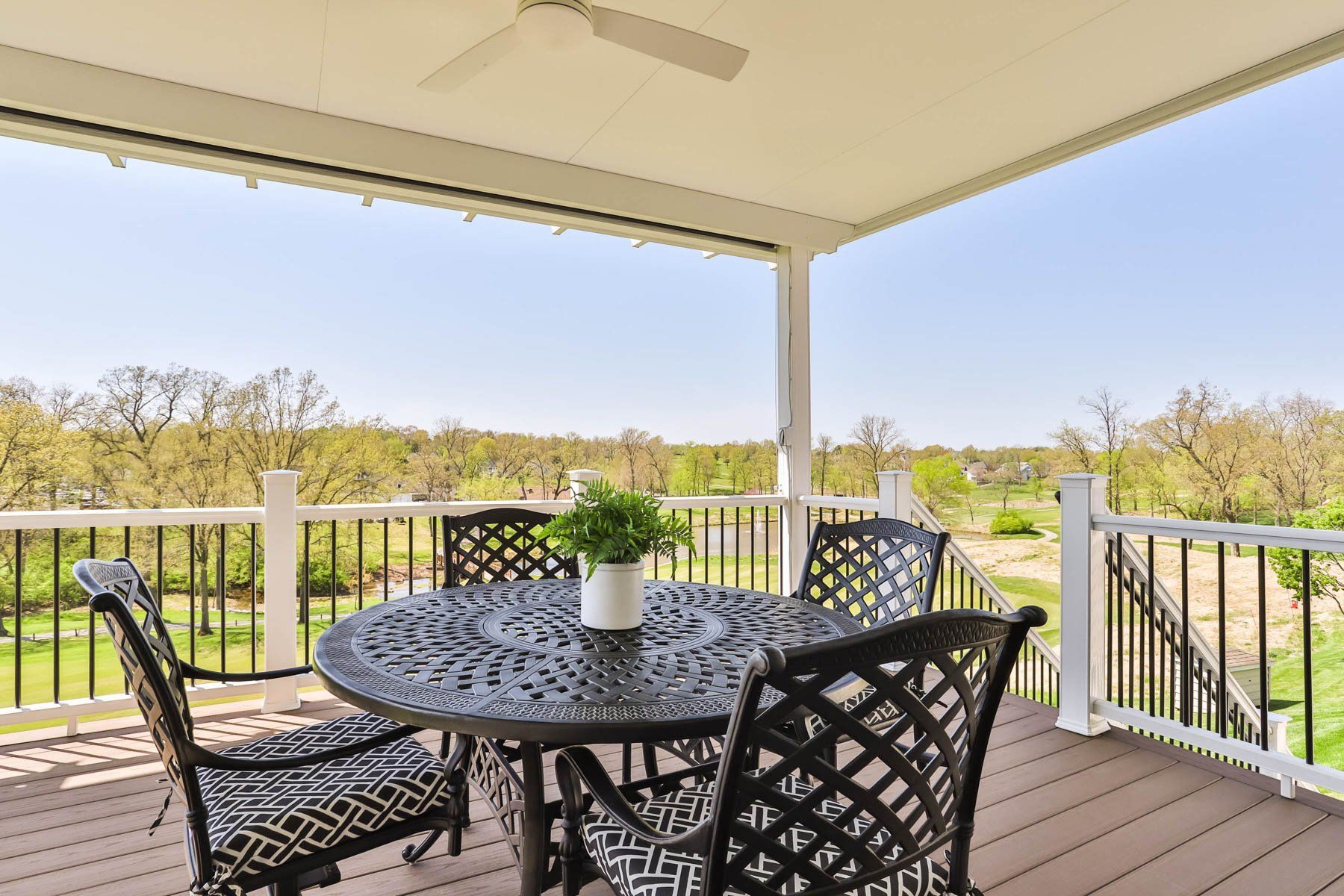 Covered deck with an outdoor table set