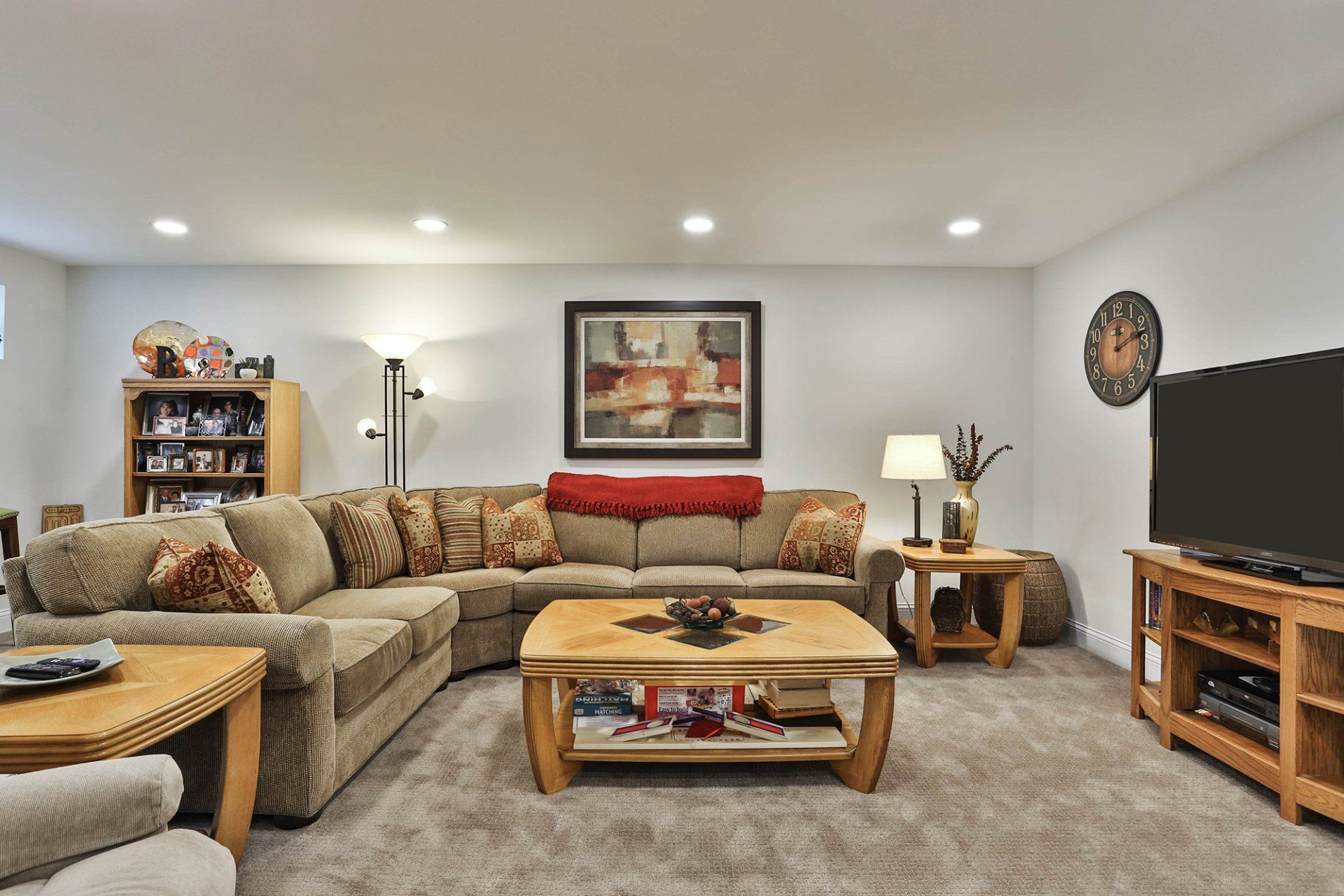 Basement living room with an L-shaped couch
