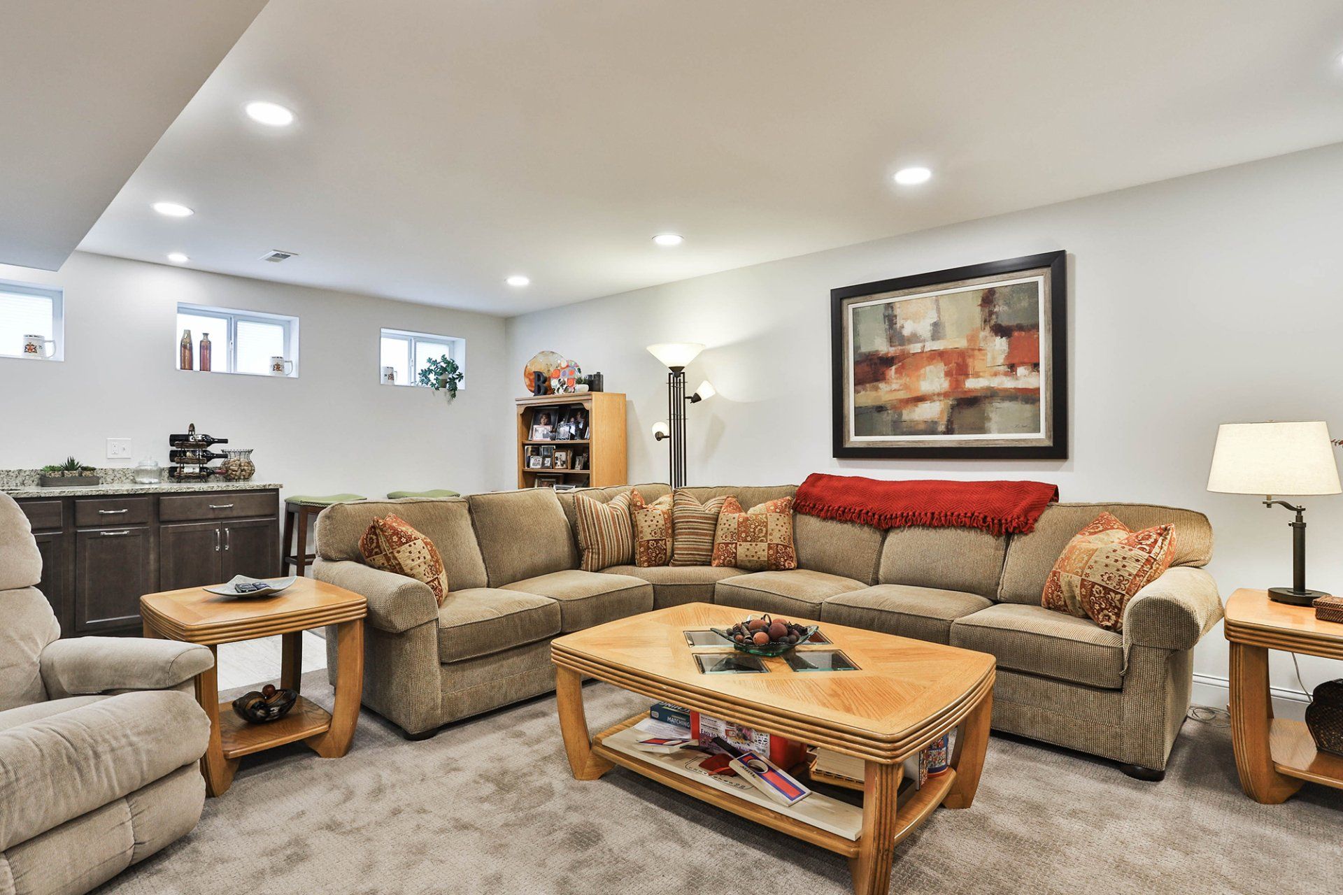 Basement living room with an L-shaped couch