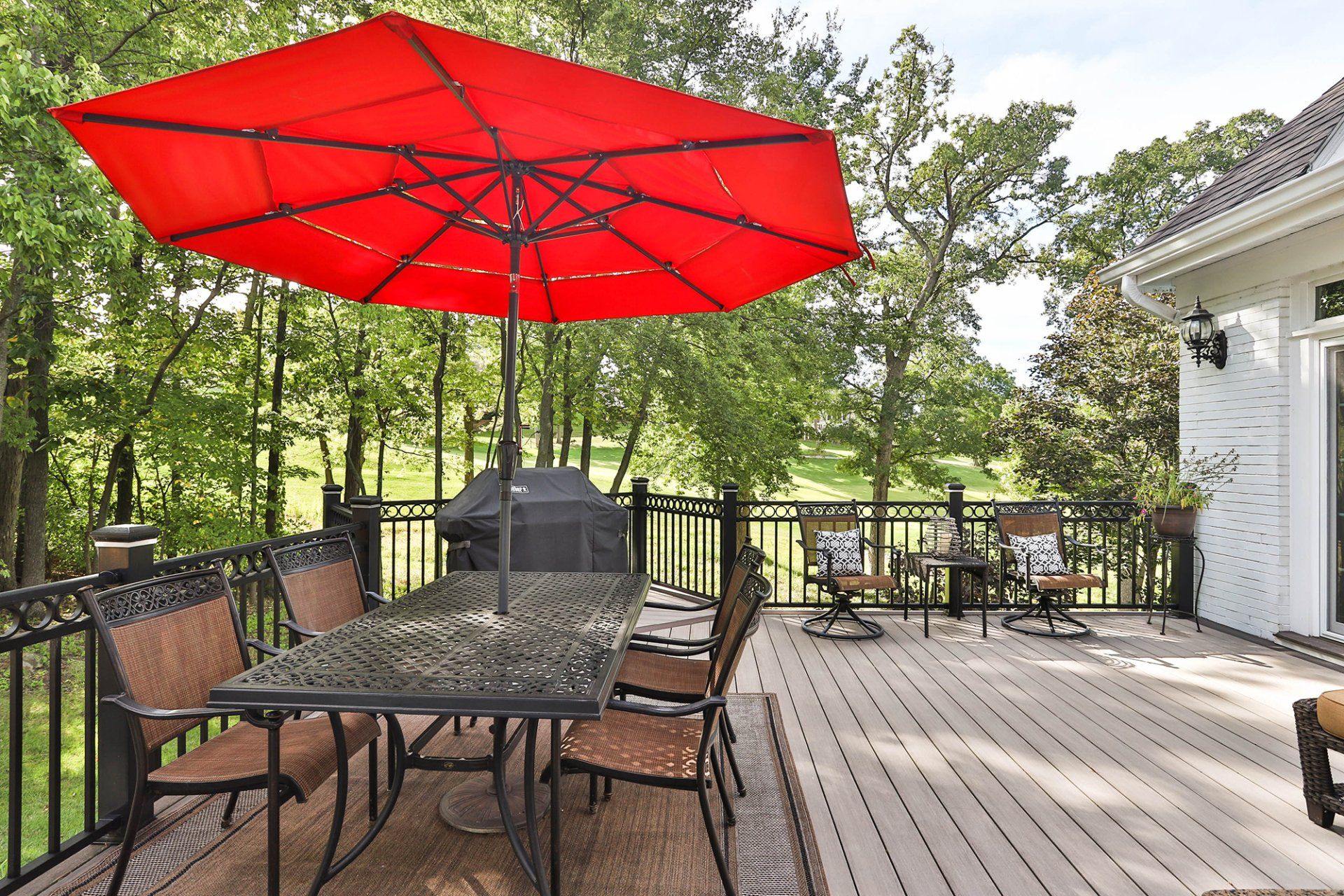 Lovely deck design with an outdoor table set