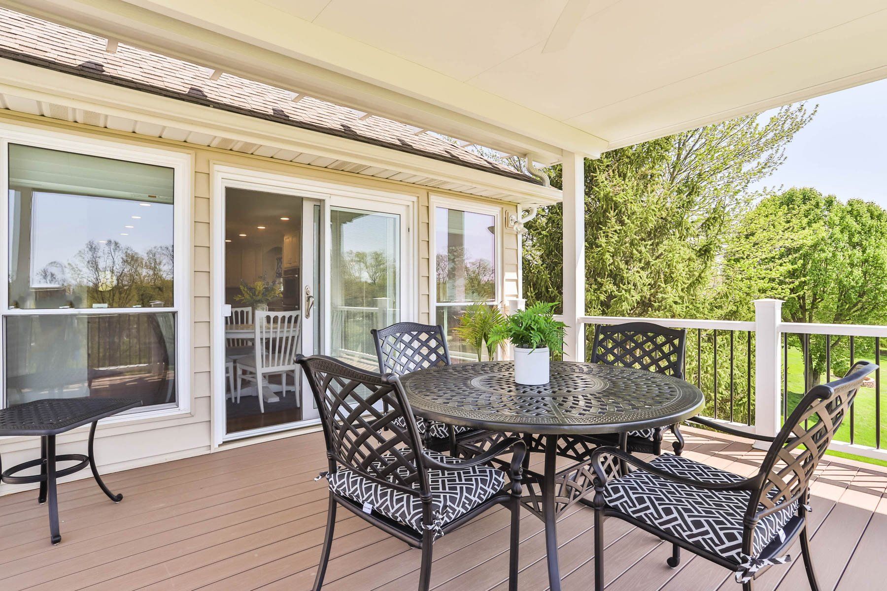 Covered deck with a round table set