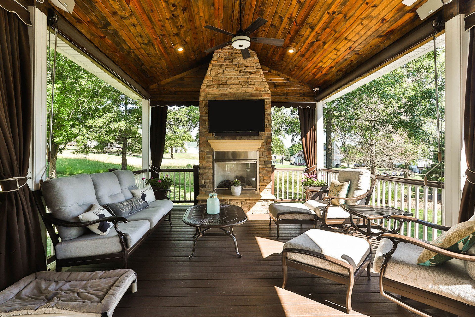 Backyard deck with a fireplace
