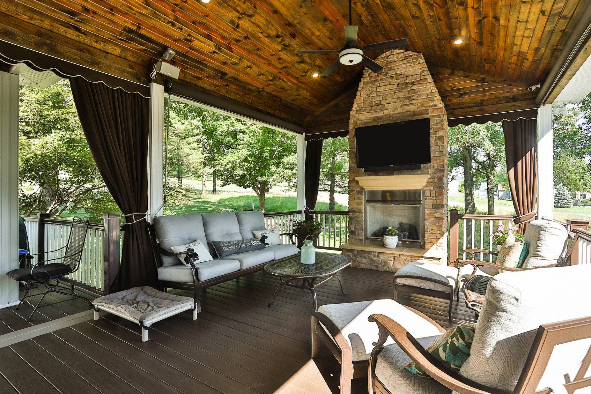 Backyard deck with a fireplace