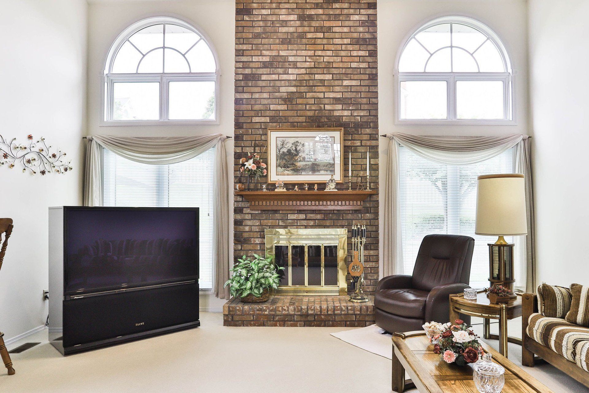 Fireplace room with arched windows