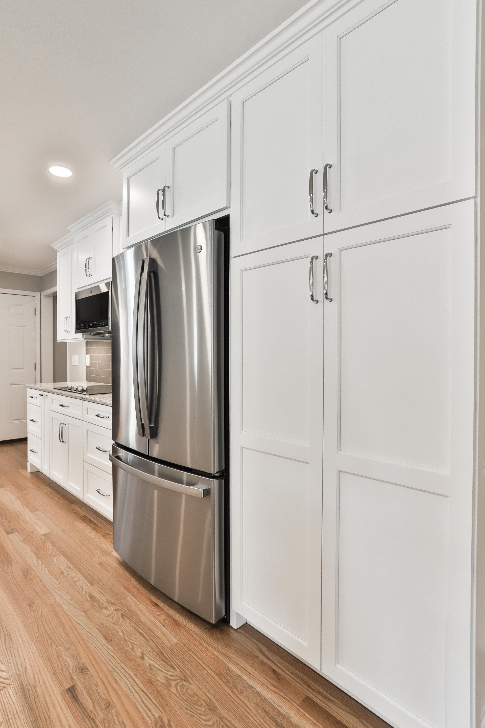 Stylish kitchen design with white cabinets