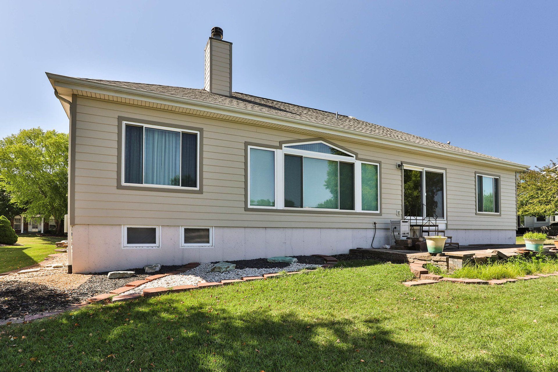 House with beige vinyl siding