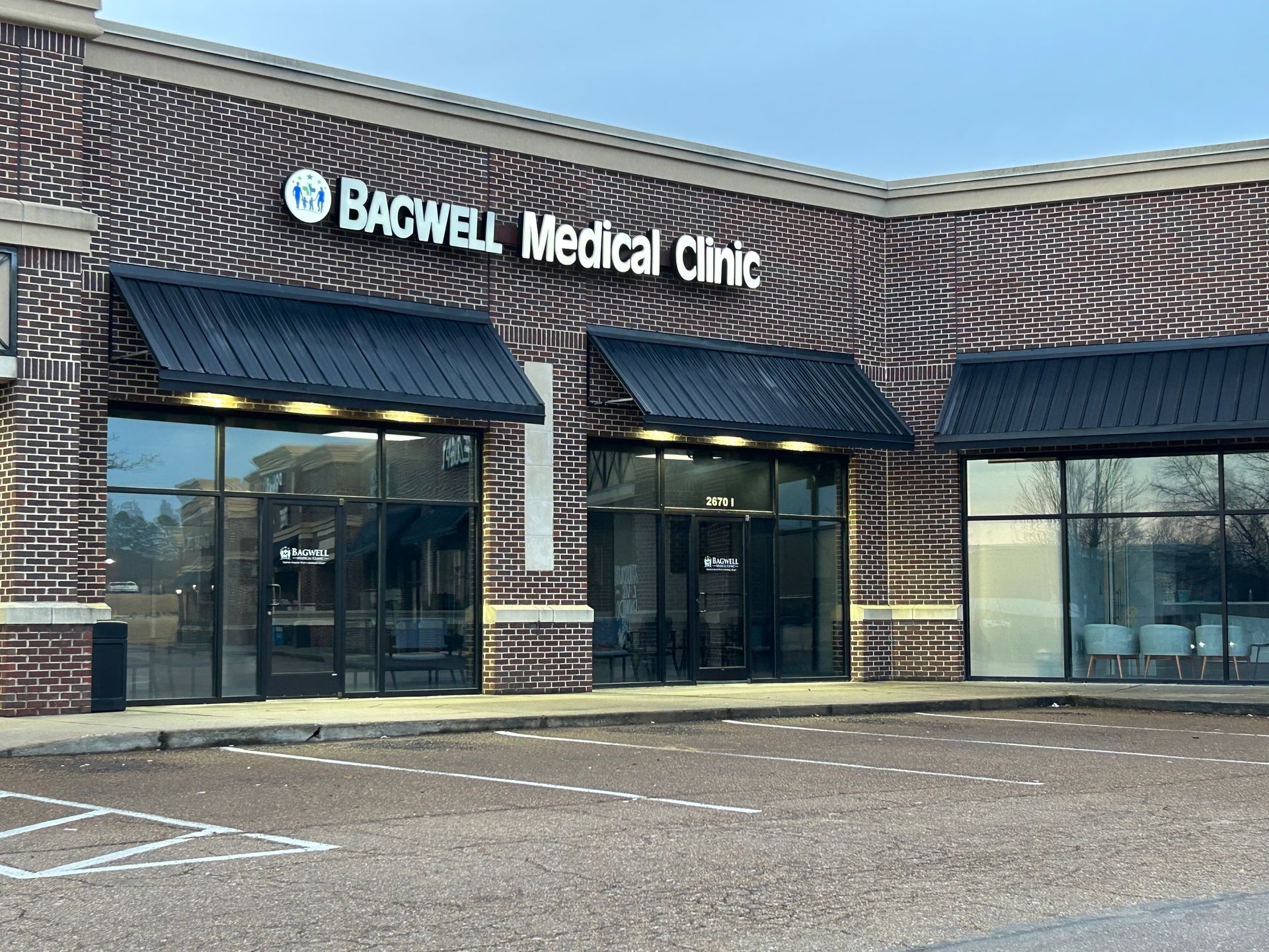A brick building with a sign that says bacwell medical clinic