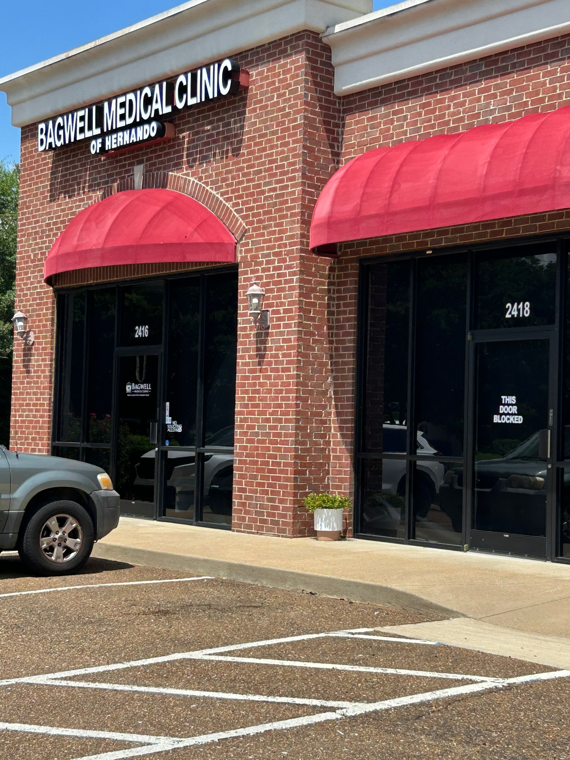 A car is parked in front of the tagwell medical clinic