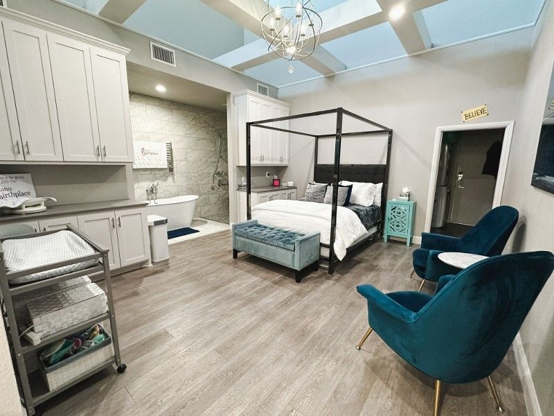 There is a four poster bed in the middle of the room.