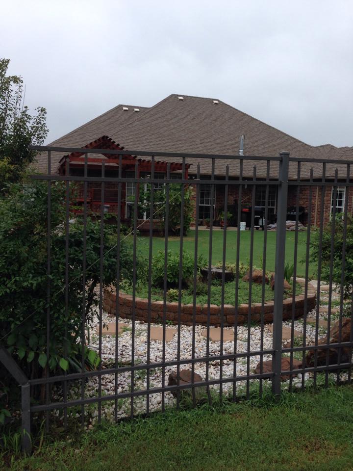 A house with a fence in front of it