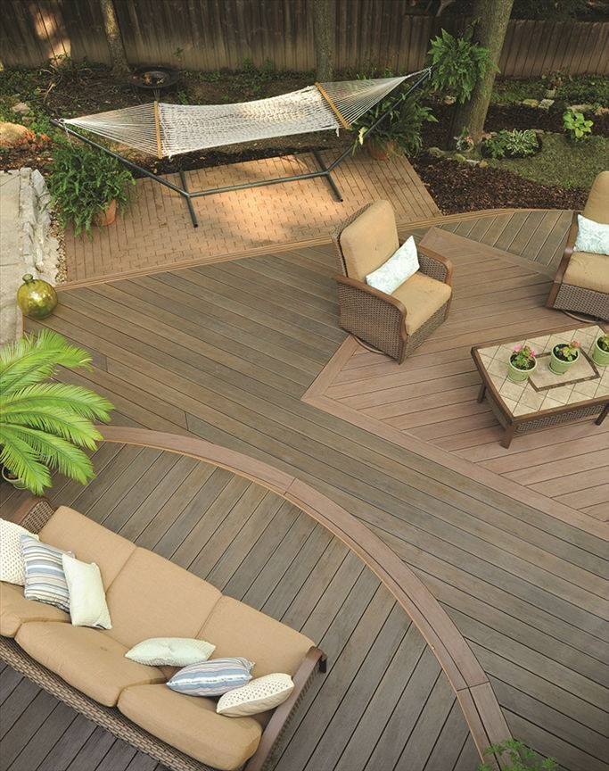 An aerial view of a deck with a couch and chairs
