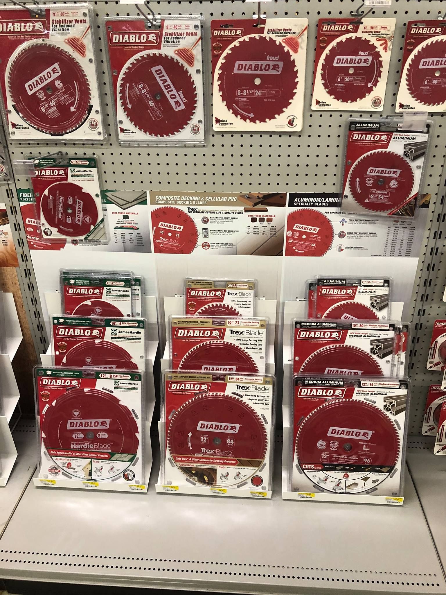 A display of red and white circles on a shelf in a store.