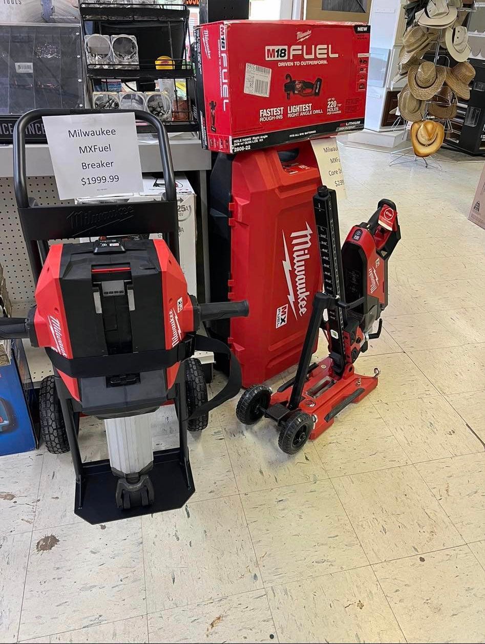 A bunch of tools are sitting on the floor in a store.