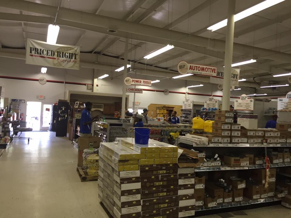 The inside of a hardware store with a sign that says priced right