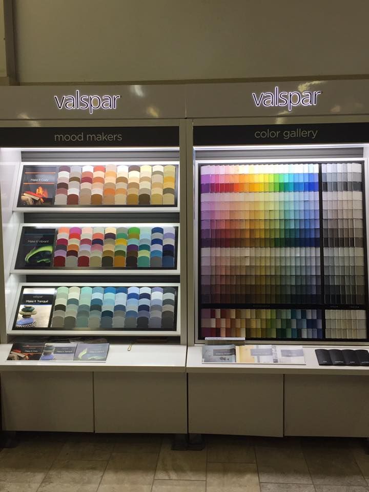 There are many different colors of paint on display in this store.