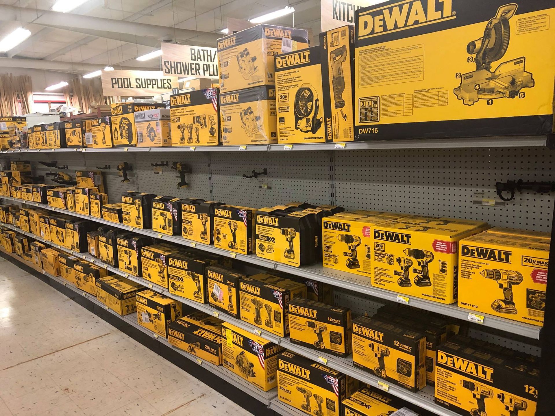 A store shelf filled with boxes of dewalt tools