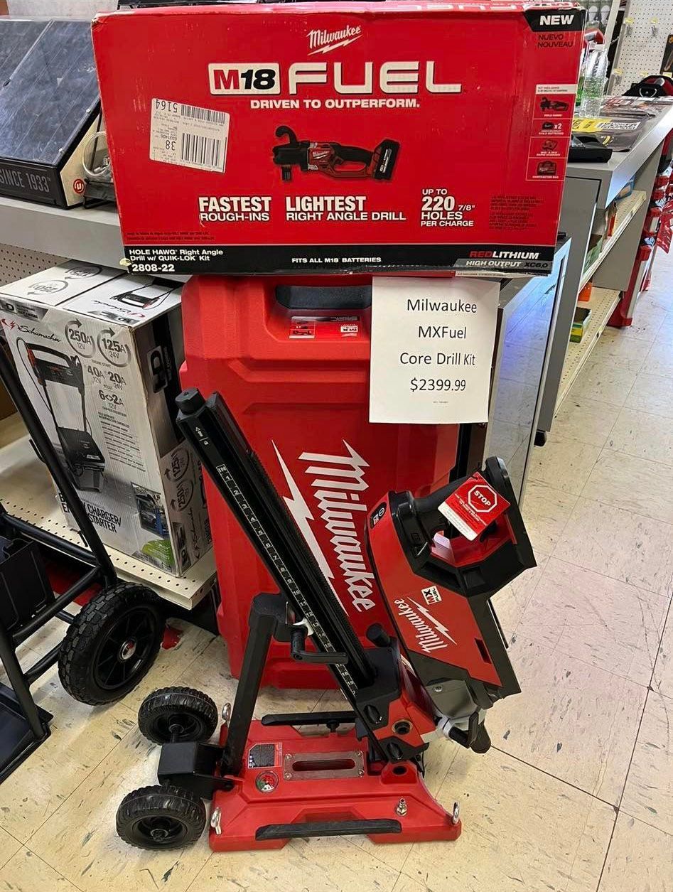 A milwaukee m18 fuel vacuum cleaner is sitting on the floor in a store.