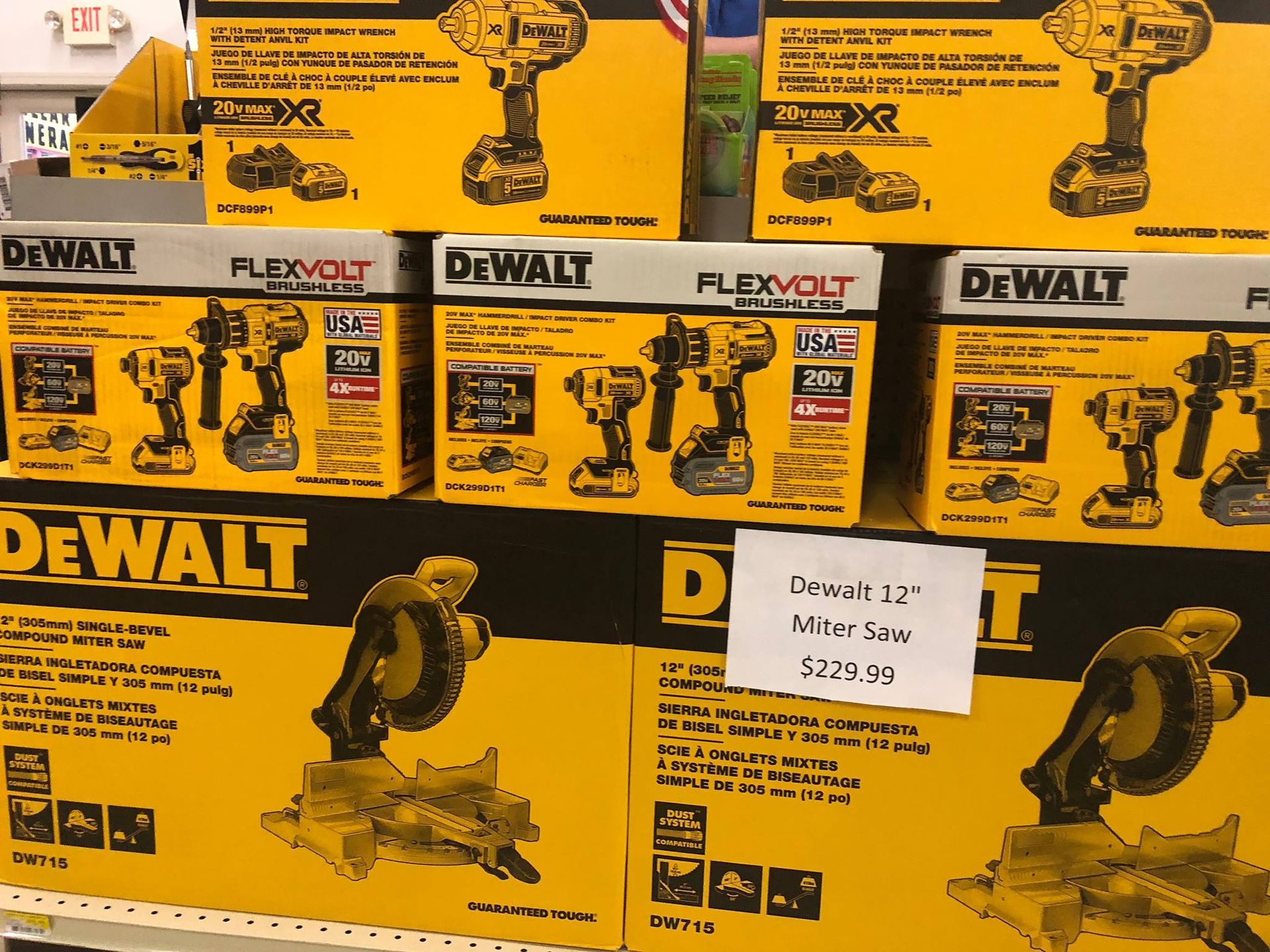 Boxes of dewalt tools are stacked on a shelf