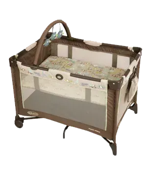 Brown and beige Graco Pack 'n Play playard with mobile and mesh sides, set on a white background.