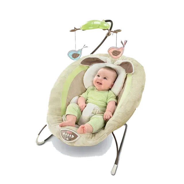 Baby in a tan and green bouncer, smiling. Includes hanging bird toys.