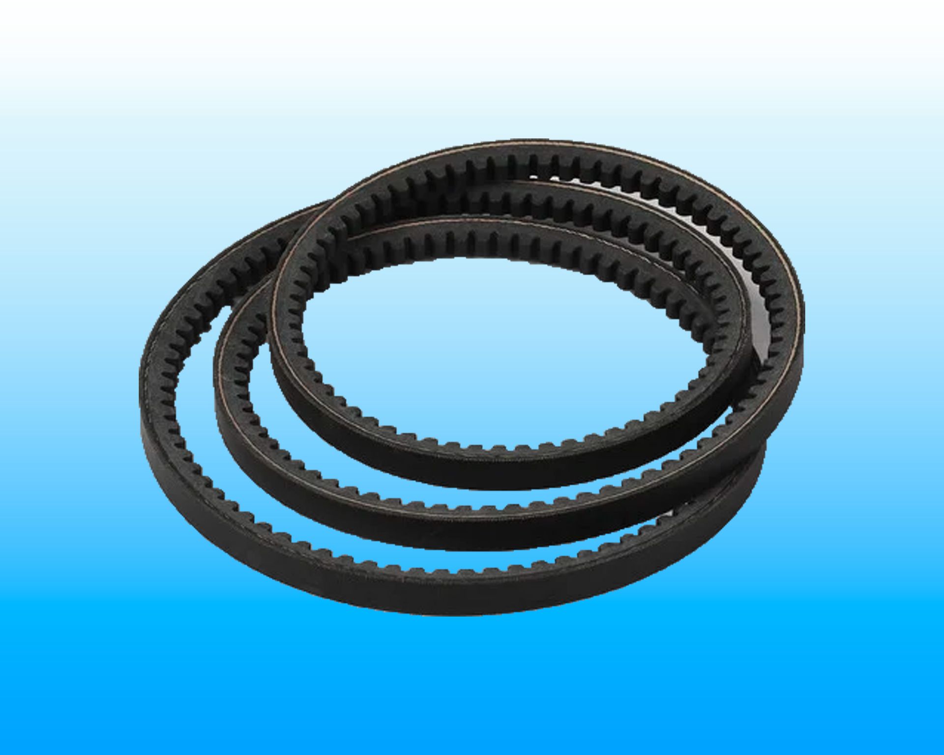 Three black belts are stacked on top of each other on a blue background