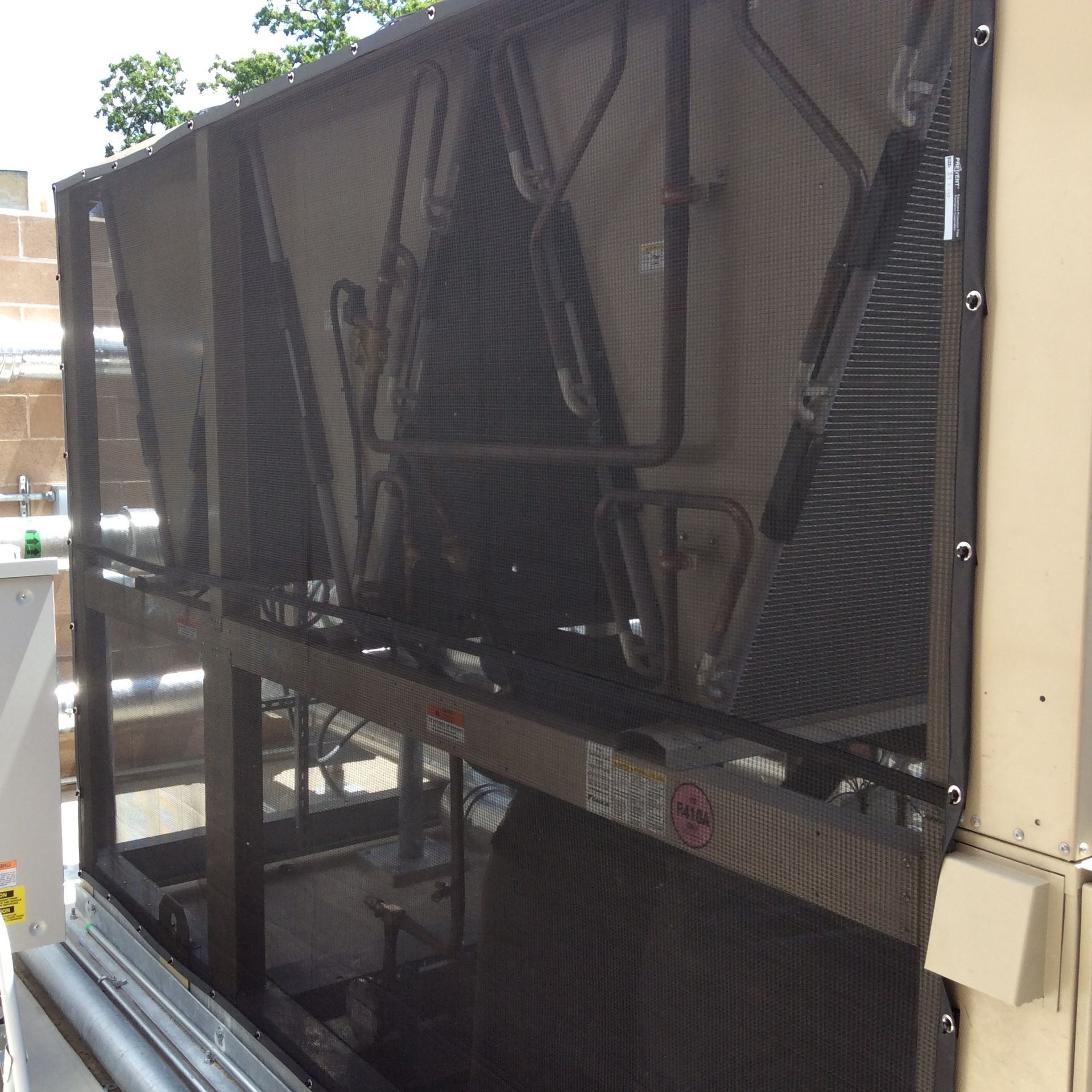 Screens covering the intake of an hvac unit