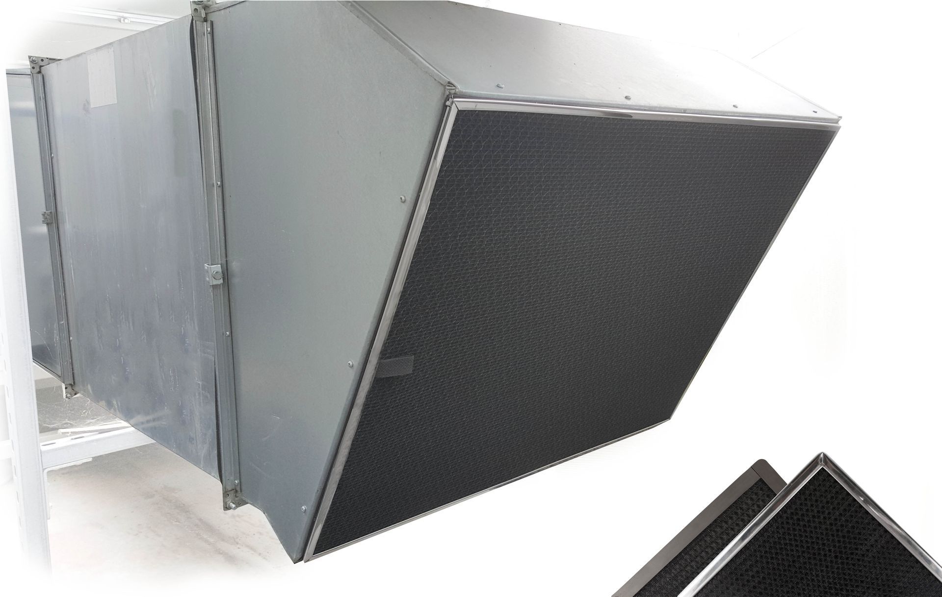 A picture of a duct with a black filter on it