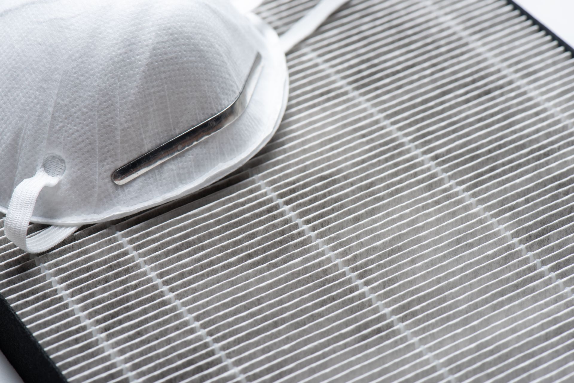 A n95 mask is sitting on top of a filter.