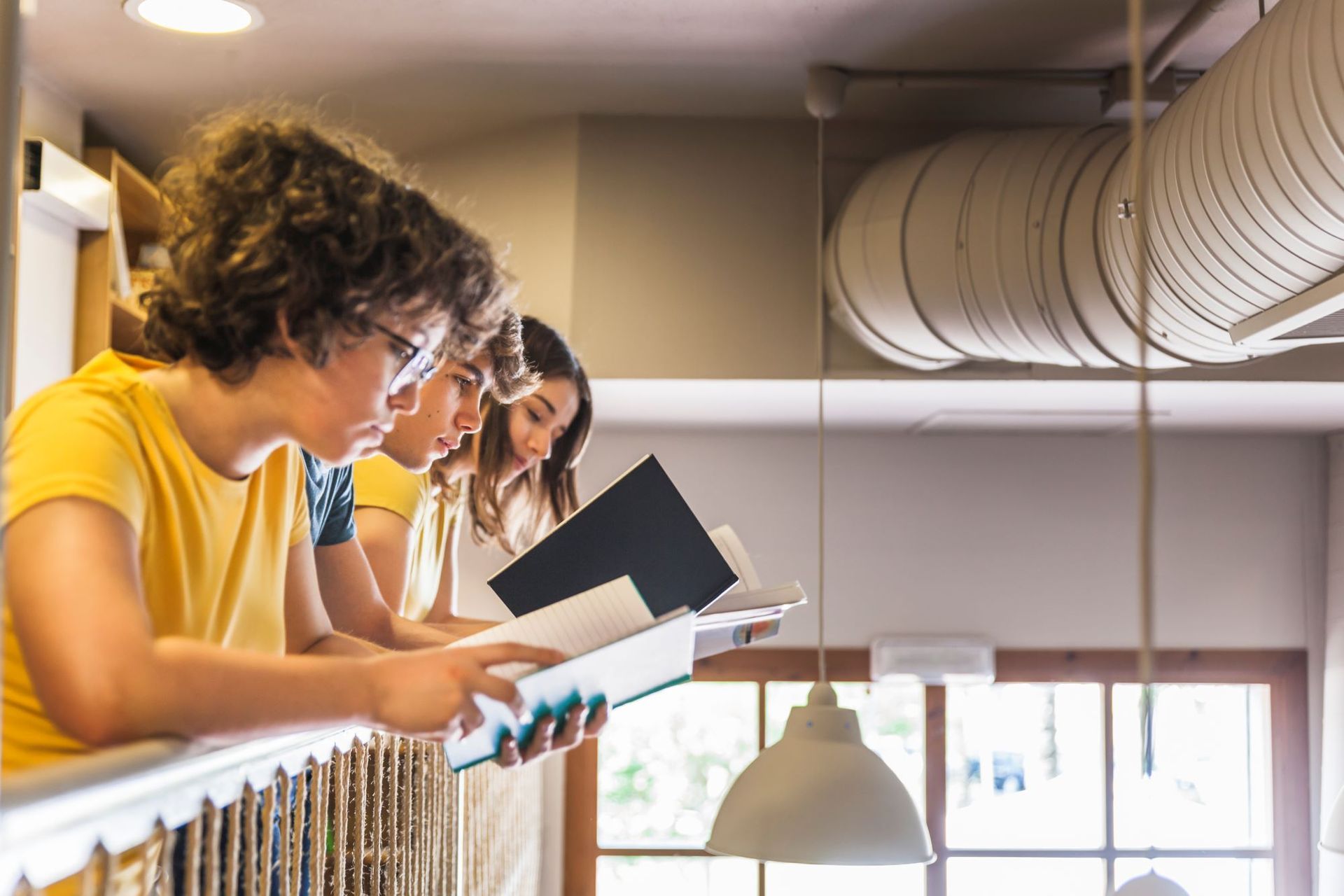 A group of children are reading books in a library.