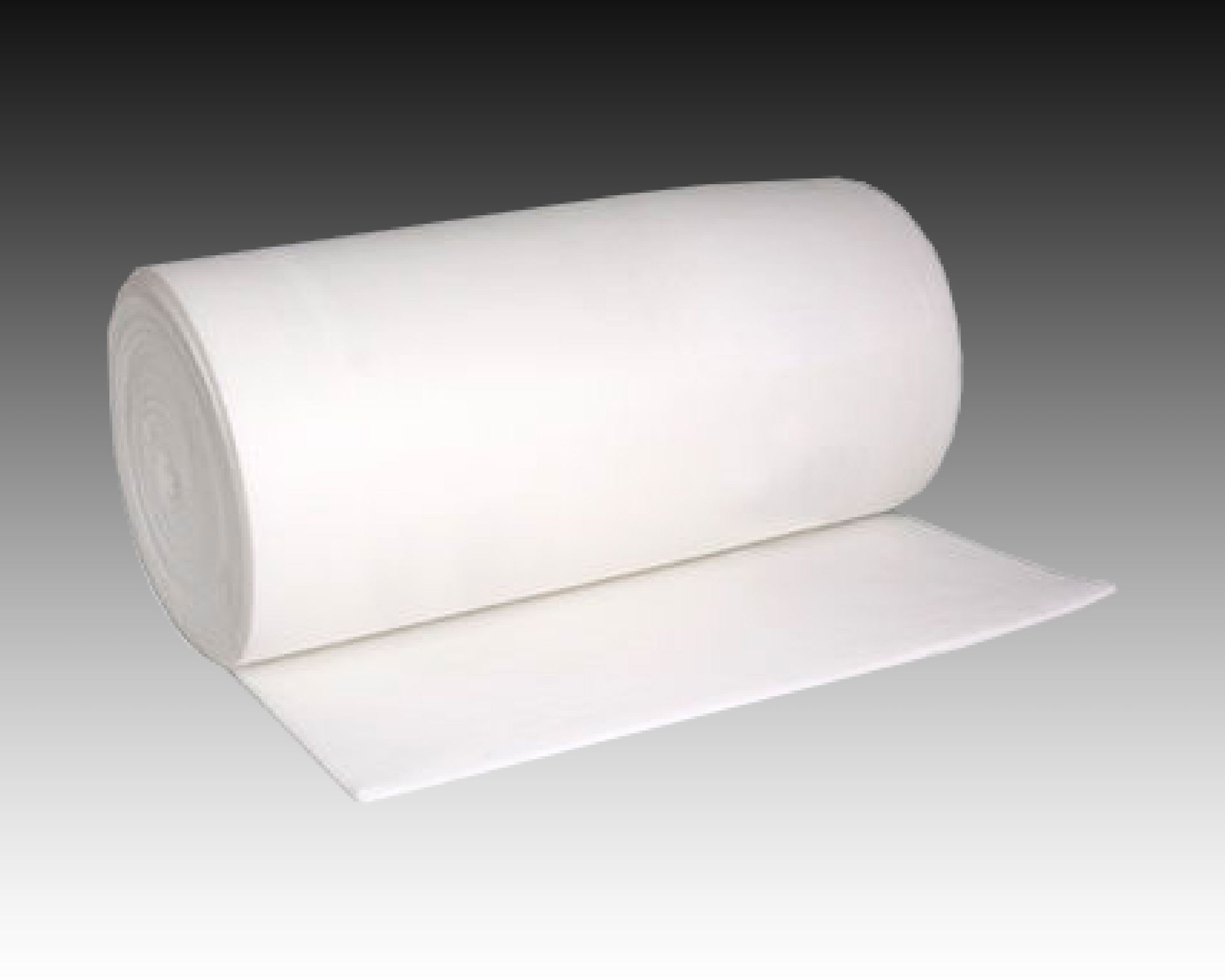 A roll of white foam is sitting on a table.