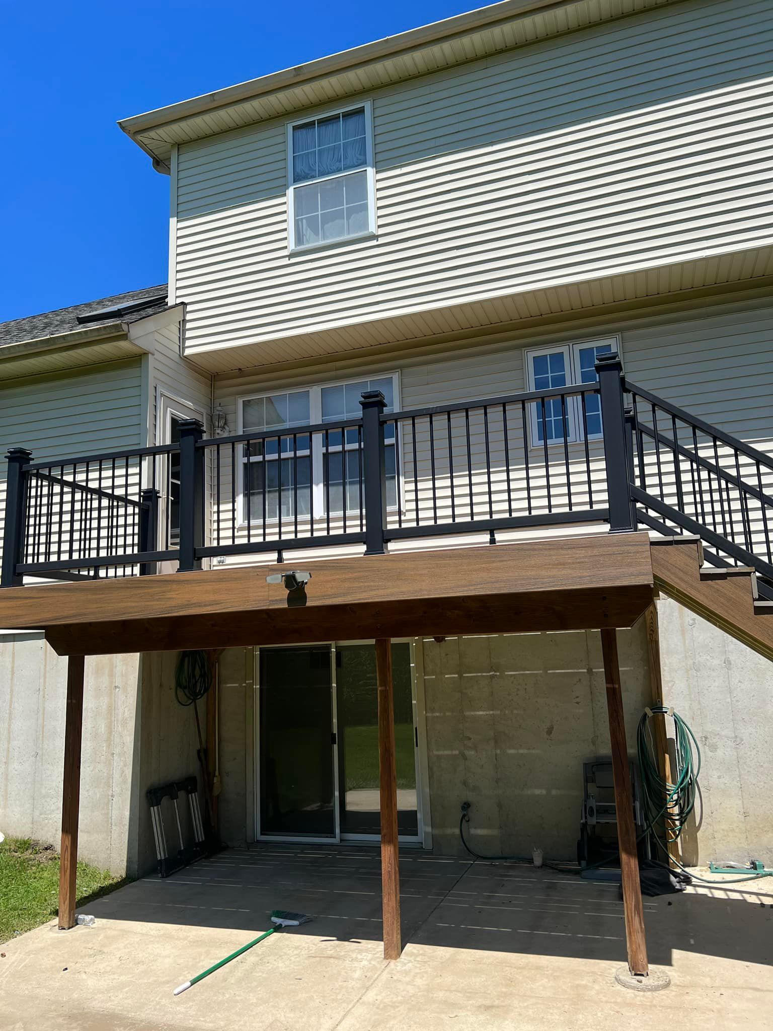 The back of a house with a deck and stairs