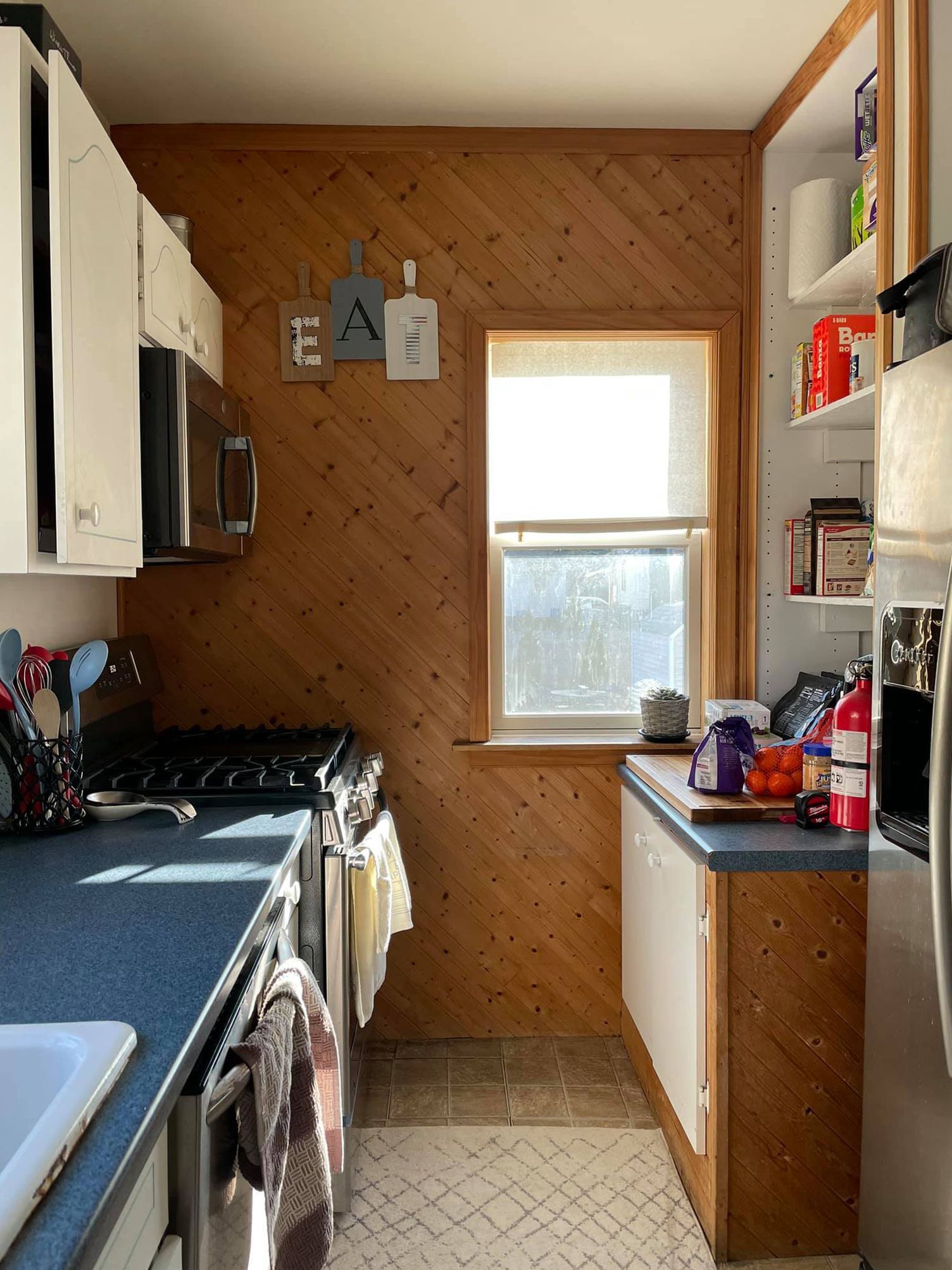 A kitchen with a sign that says eat on it