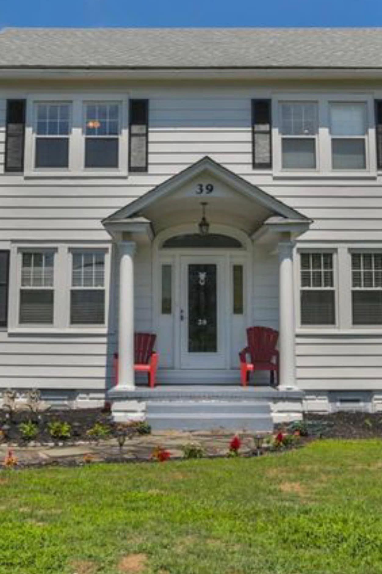 A white house with the number 39 on the front of it