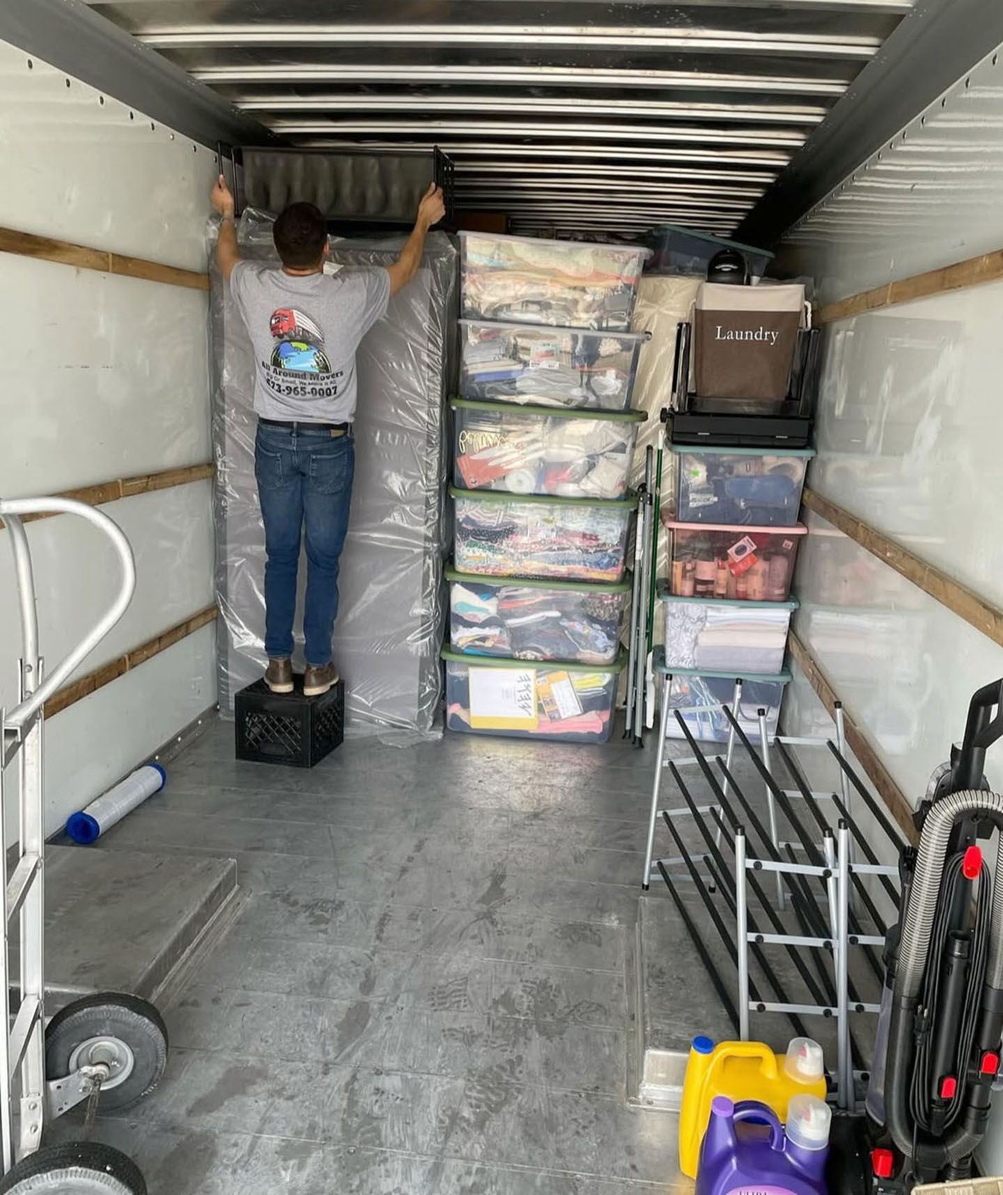 A man is loading a moving truck