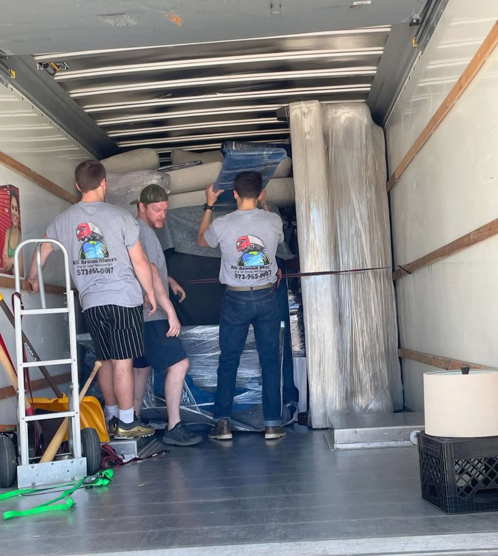 A group of men loading a moving truck