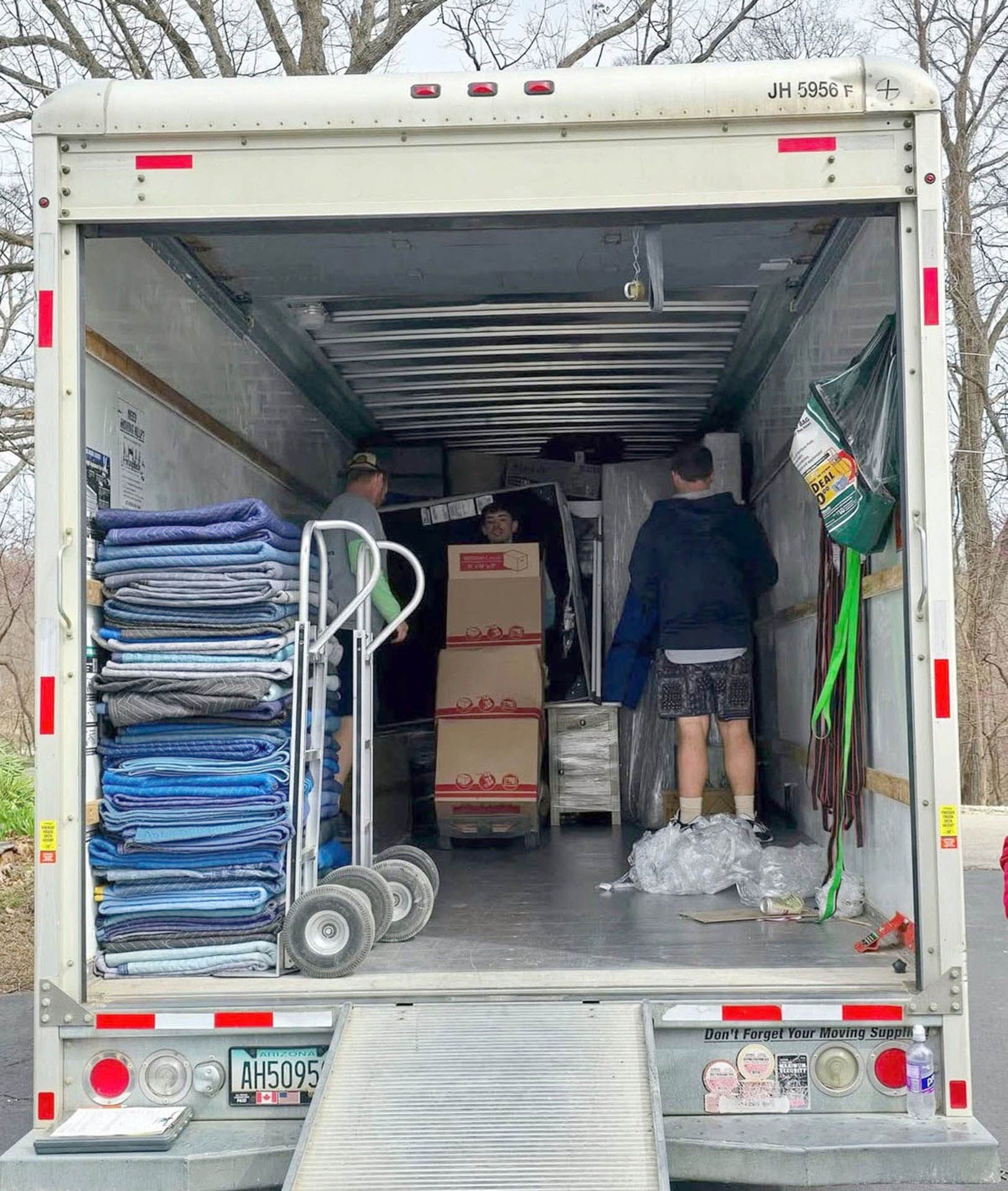Men loading boxes into a moving truck