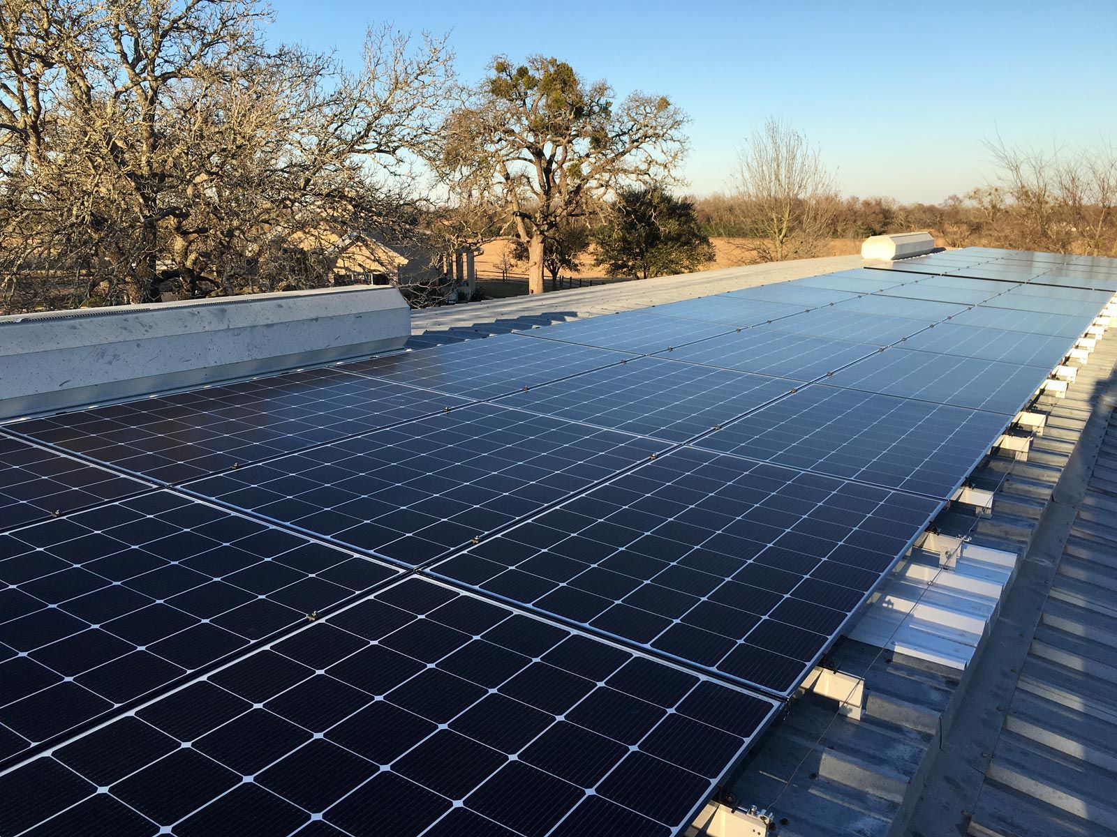 A roof with a lot of solar panels on it