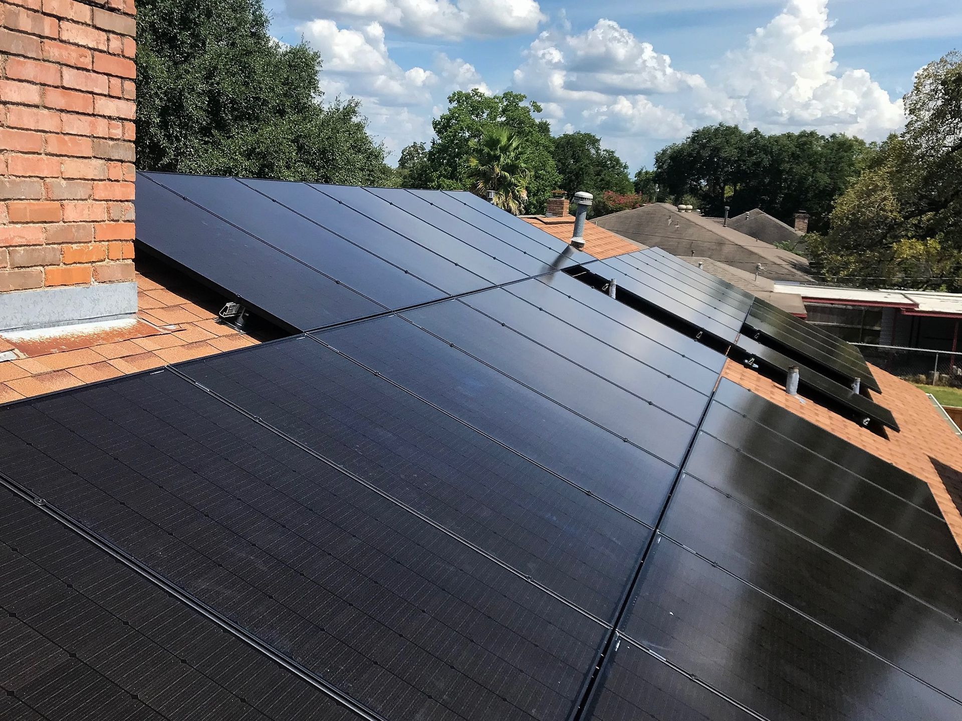 A roof with a lot of solar panels on it