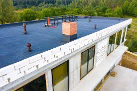 an aerial view of a building under construction with a flat roof .