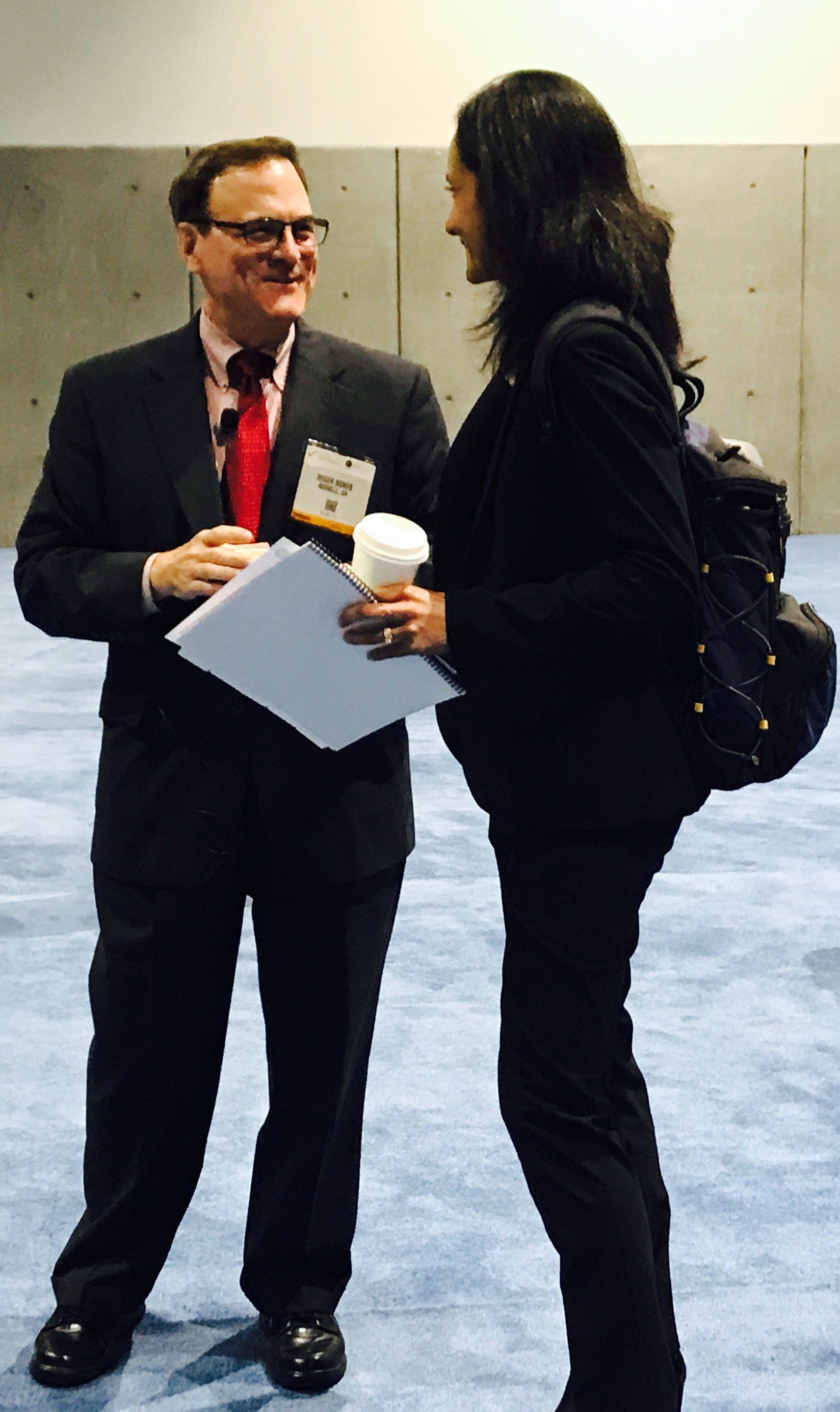 Roger speaking to a woman