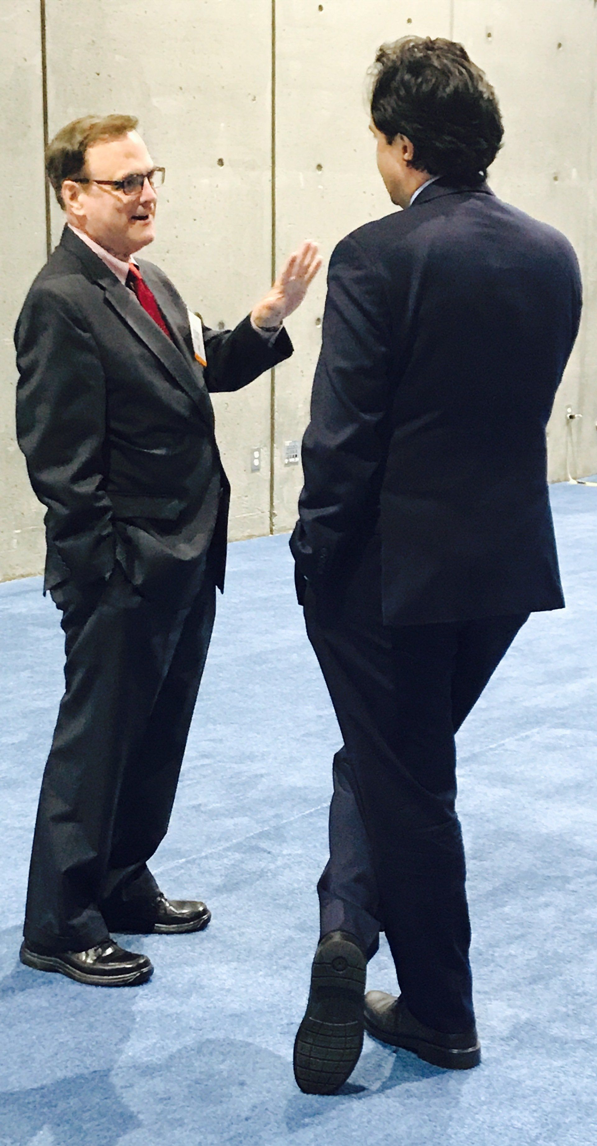 Roger speaking to a man