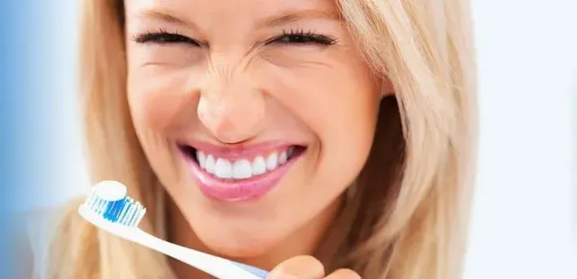 Women holding toothbrush