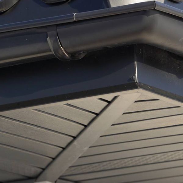 Black roof guttering and soffit corner.