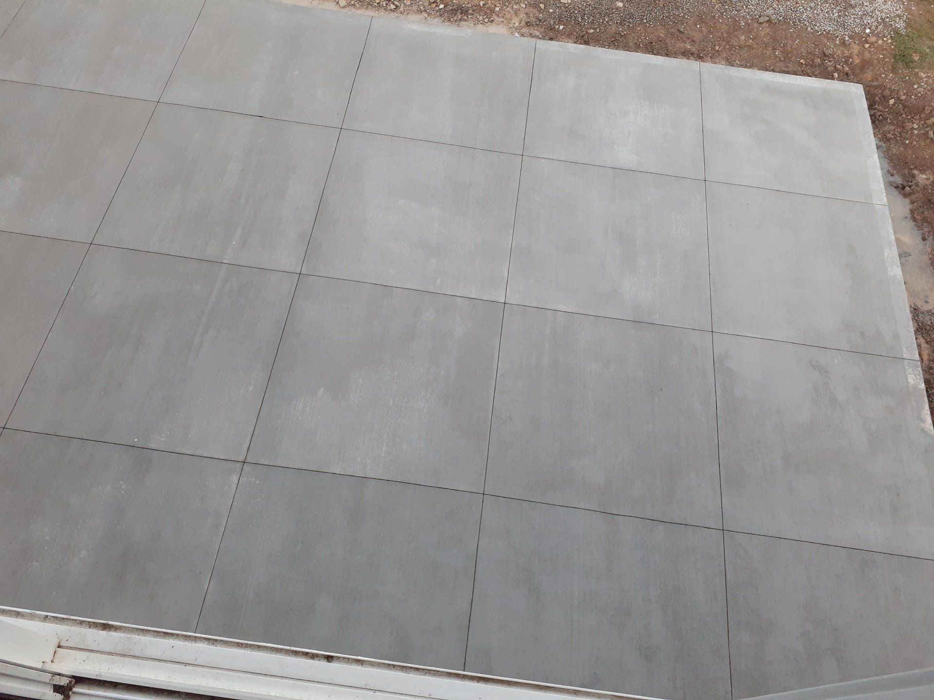 A concrete floor with a lot of squares on it