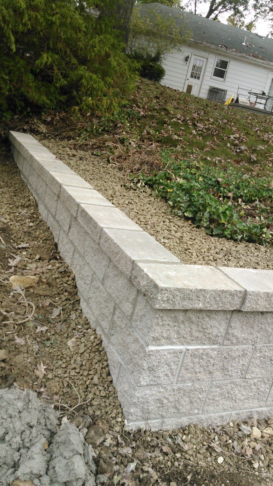 A set of stairs leading up to a brick wall.