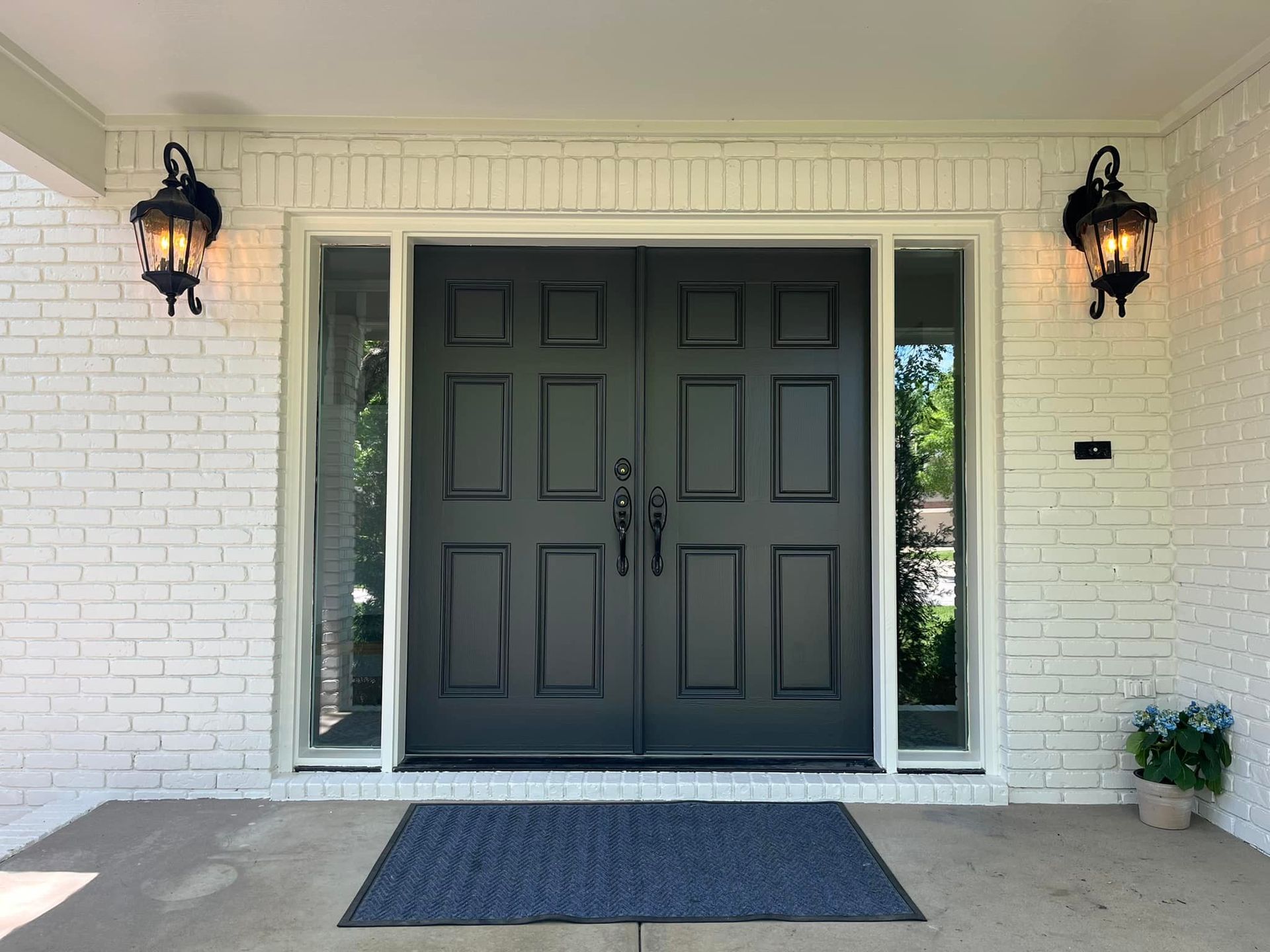 Painted white brick and black door in Urbandale, Iowa. 