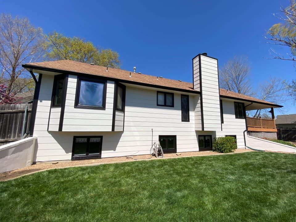 Painted White house with black trim in Urbandale, Iowa. 