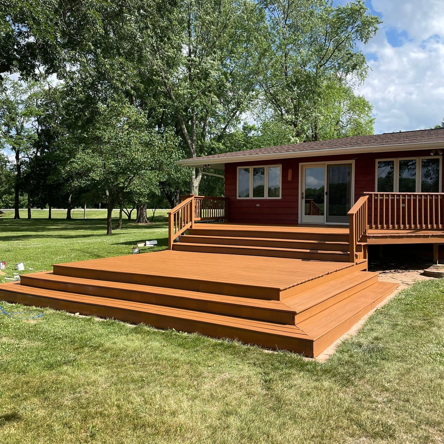stained wood deck light brown deck with stairs in Des Moines, Iowa. 