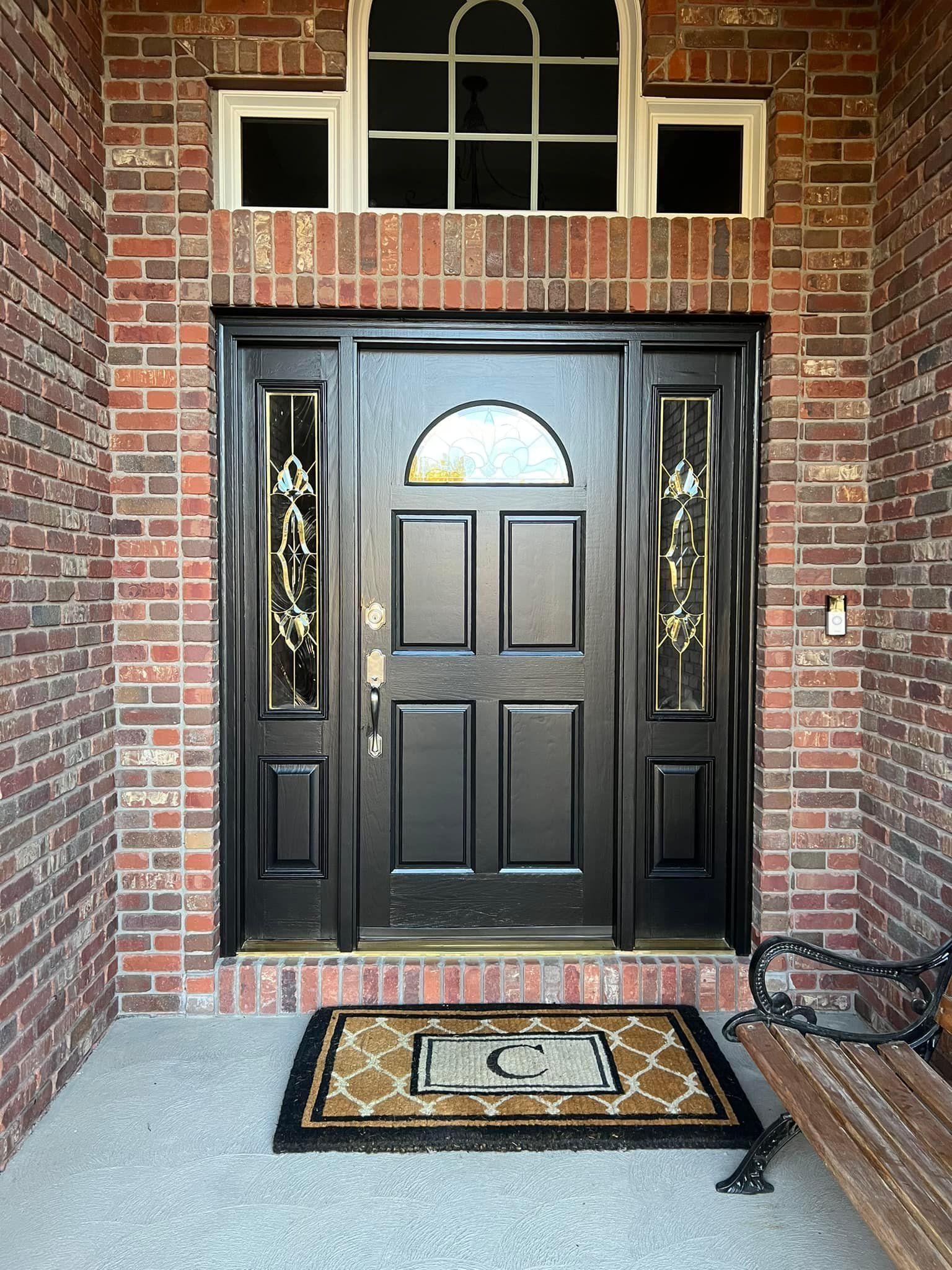Exterior door painted on brick house in  Ankeny, Iowa.